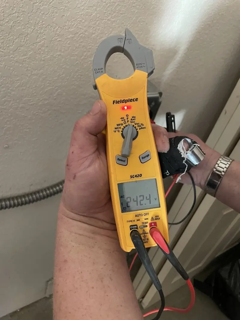 Voltage testing with clamp meter during Electrical Installation Services in Primera
